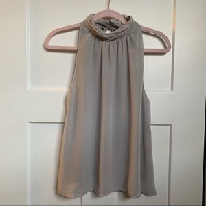 Sleeveless blouse with beautiful neck detail